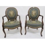A pair of 20th century mahogany framed parlour armchairs with floral tapestry upholstery (2)