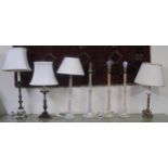 A mixed lot of three assorted cast metal base table lamps and two pairs of turned wooden table lamps