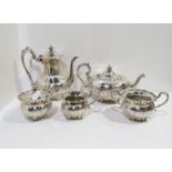 A five piece EPNS tea service, the teapot of melon form, all with chased scrolling foliate