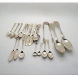 A collection of silver including flatware, sugar tongs by William Marshall, Edinburgh 1827, two