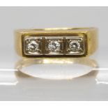 An 18ct gold three stone diamond ring, set with estimated approx 0.12cts, finger size L, weight 3.