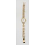 A 9ct gold Rotary ladies watch with oval face, weight with mechanism, 17 gms Condition Report: