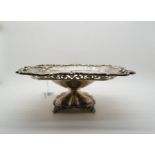 An Edwardian silver tazza, of rectangular form with pierced scrolling fretwork, on a lobed base upon