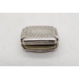 A George III silver vinaigrette, of shaped rectangular form, with engraved floral decoration