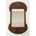 A walnut framed square wall mirror with gilt carving of a knights helm upon crossed halberds, 64cm