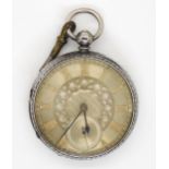 A large silver open face pocket watch, with London hallmarks, 1884, diameter 5.6cm, with key