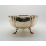 An Art Nouveau rose bowl, of lobed stylised form, upon three leaf motif feet, by James Aitchison,