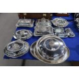 A collection of silver plated entrée dishes, comprising three rectangular examples, a large circular