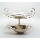 An Edwardian silver tazza, with art nouveau stylised handles, on a footed and knopped circular base,