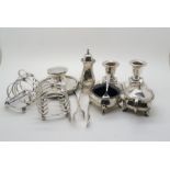 A collection of silver including a pair of four division silver toast racks, by Atkins Brothers,