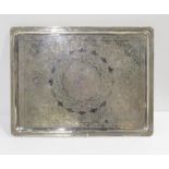 An Iranian silver rectangular serving tray, with chased decoration of arabic floral motifs,