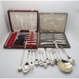 A collection of silver including silver and enamel city souvenir spoons, some stamped sterling, a