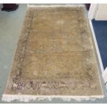 A modern beige ground tree of life rug, 195cm long x 125cm wide Condition Report:Available upon