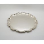 A George VI silver serving tray, with piecrust rim, by Charles Green & Sons, Birmingham 1936, 425gms