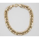 A gold curb link bracelet, stamped 9kt, 21cm long, 10.3gms Condition Report:Available upon request