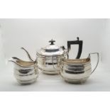 A matched three piece silver tea service, the bodies with banding and reeded rims, by S.