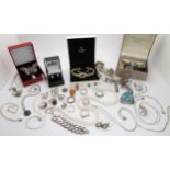 A collection of silver and white metal jewellery to include a buttefly brooch, cz set flower bangle,