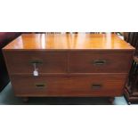 A 19th century camphorwood campaign chest with two short drawers above one long on turned feet,