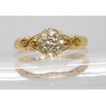 An 18ct gold diamond cluster ring set with estimated approx 0.20cts of old cut diamonds,