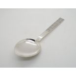 A Norwegian silver serving spoon, the terminal decorated with square vignettes of birds and