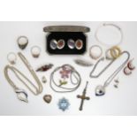 A collection of silver and costume jewellery to include, lockets, an infinity pendant, earrings,
