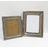 Two Iranian silver photo frames, decorated with arabic lozenge and medallion motifs, both