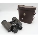 A pair of Carl Zeis Jena Jenoptem 8x30 binoculars serial number 6537625 together with a pair of