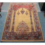A 20th century yellow ground Kayseri rug with multicoloured border, 200cm long x 134cm wide