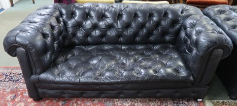 A 20th century black leather button back chesterfield style drop end club settee, 68cm high x