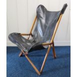 A mid 20th century Joseph B Fendy Tripolina campaign style folding chair with black leather seat