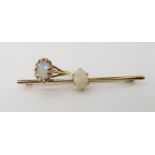 A 9ct white gold opal ring, size M1/2, weight 1.9gms, together with a 15ct gold bar brooch set