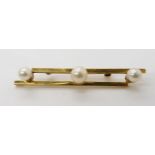 A 9ct gold three pearl brooch, length 6cm, weight 7.4gms Condition Report:Available upon request