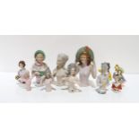 A collection of porcelain half dolls (11) Condition Report:Available upon request