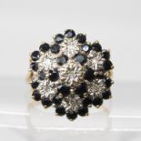 A 9ct gold sapphire and diamond accent cluster ring, size N, weight 4.5gms Condition Report: