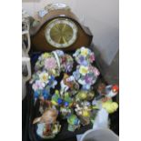 A collection of porcelain bird figures, flower posies, two Royal Crown Derby plates, assorted plates