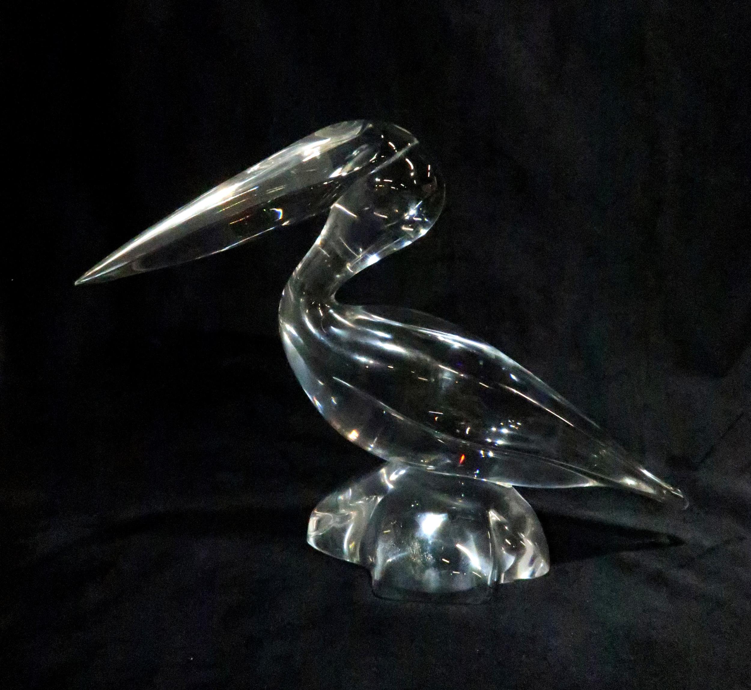 A Daum clear glass model of a pelican perched on a rock, etched mark to base, 22cm high Condition