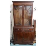 A 20th century mahogany astragal glazed display wall unit on cabinet base Condition Report:Available