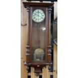A 20th century mahogany cased Vienna style wall clock and an oak cased mantle clock (2) Condition