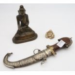 A bronze Buddha together with a smaller example and an eastern decorative dagger Condition Report: