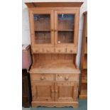 A contemporary glazed pine kitchen cabinet Condition Report:Available upon request