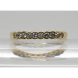 An 18ct gold diamond half eternity ring, set with estimated approx 0.25cts of brilliant cut