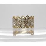 A 9ct gold lacy design dress ring set with estimated approx 0.25cts of diamonds, finger size P1/2,