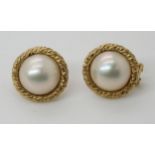 A pair of yellow metal mabe pearl earrings Condition Report:Available upon request