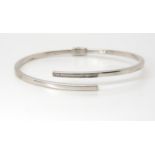 An Italian made 9ct white gold diamond accent bangle, weight 6.1gms Condition Report:Available