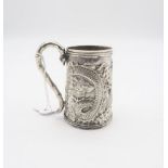 A Chinese export silver tankard, the body embossed with a dragon amongst clouds chasing a flaming