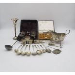 A collection of silver including a set of open silver salts and spoons, the bodies with embossed