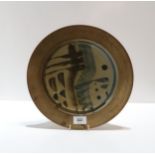 A Studio Pottery stoneware plate, glazed and decorated with washes of blue and black abstract