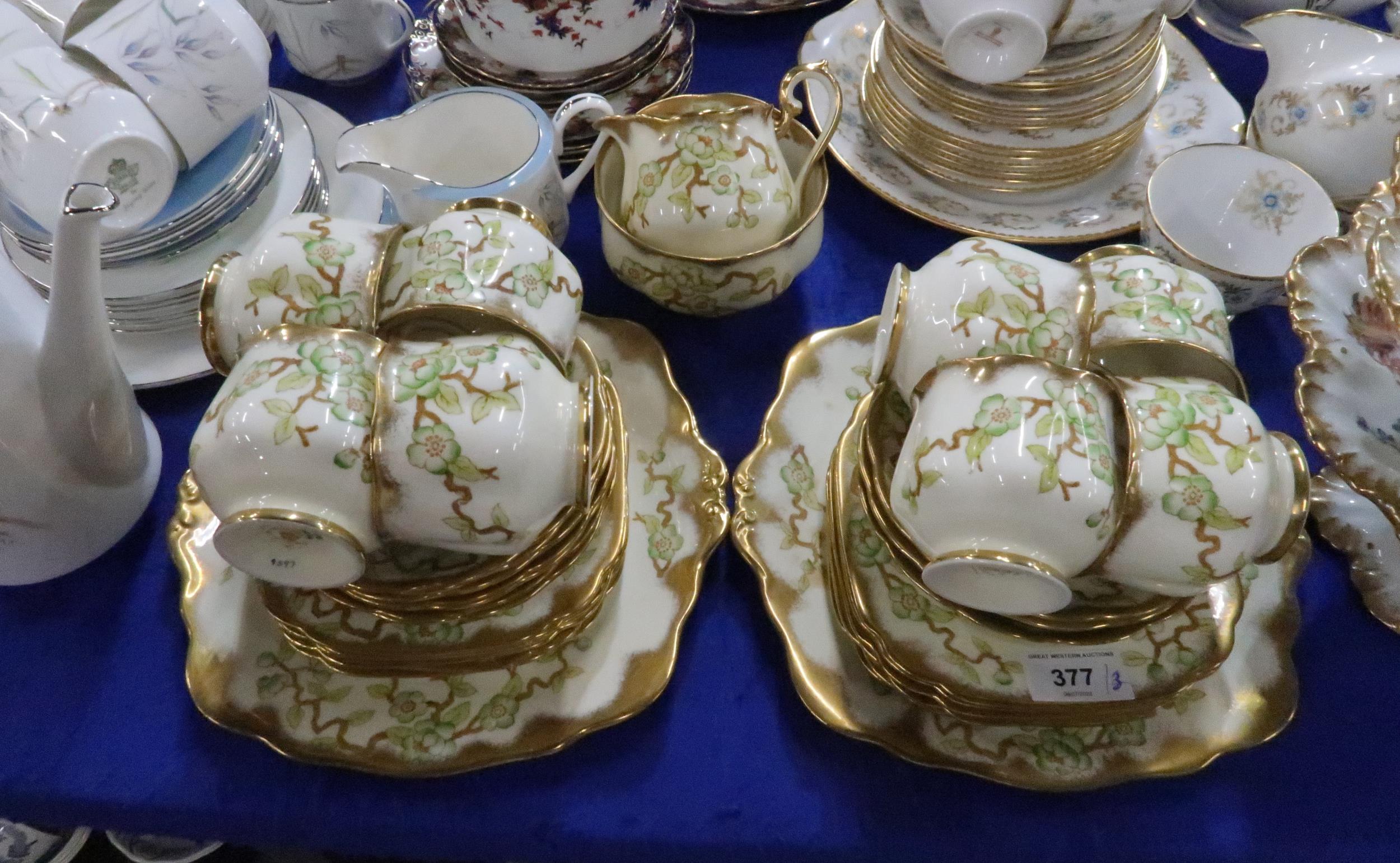 A Royal Albert Prunus blossom decorated teaset, a Aynsley Flying Wild teaset and a pottery rose