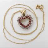 A 9ct gold ruby and diamond set heart shaped pendant on a fine curb chain, weight 4.5gms Condition