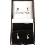 A pair of diamond earrings in a Mappin & Webb box, set with estimated approx 0.16cts of brilliant